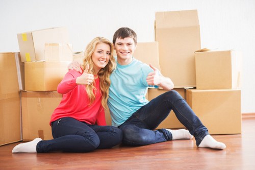 Moving team loading furniture during house removals in Newbarnet